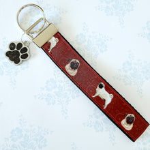 Load image into Gallery viewer, Pugs and Swirls Key Fob with Enameled Paw Print Charm
