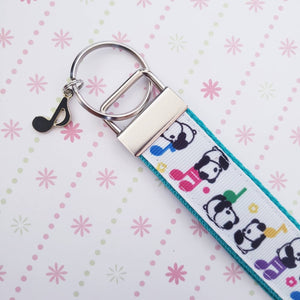 Pandas Sitting on Notes Key Chain Fob with Enameled Note Charm