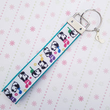 Load image into Gallery viewer, Pandas Sitting on Notes Key Chain Fob with Enameled Note Charm
