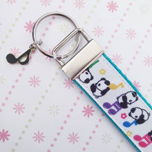 Load image into Gallery viewer, Pandas Sitting on Notes Key Chain Fob with Enameled Note Charm
