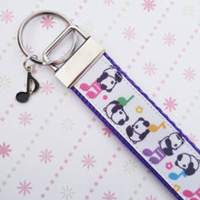 Load image into Gallery viewer, Pandas Sitting on Notes Key Chain Fob with Enameled Note Charm
