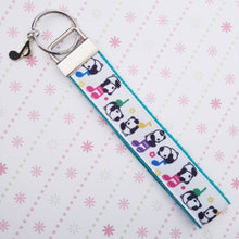 Load image into Gallery viewer, Pandas Sitting on Notes Key Chain Fob with Enameled Note Charm
